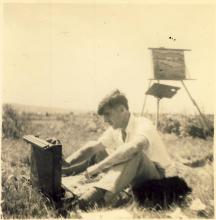 <p>c1944 – George Whalley in France painting with his brother, Peter Whalley, who took the photo</p>