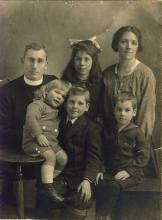 <p>1919, Christmas - The Whalley family. Back row: Rev. Arthur Francis Cecil Whalley, George’s father, Cecila, his sister, and Dorothy, his mother. Front row: Peter, his youngest brother, George Whalley, and Basil, his brother</p>