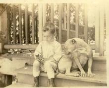 <p>c1920-22 - George Whalley with Judy, the dog</p>